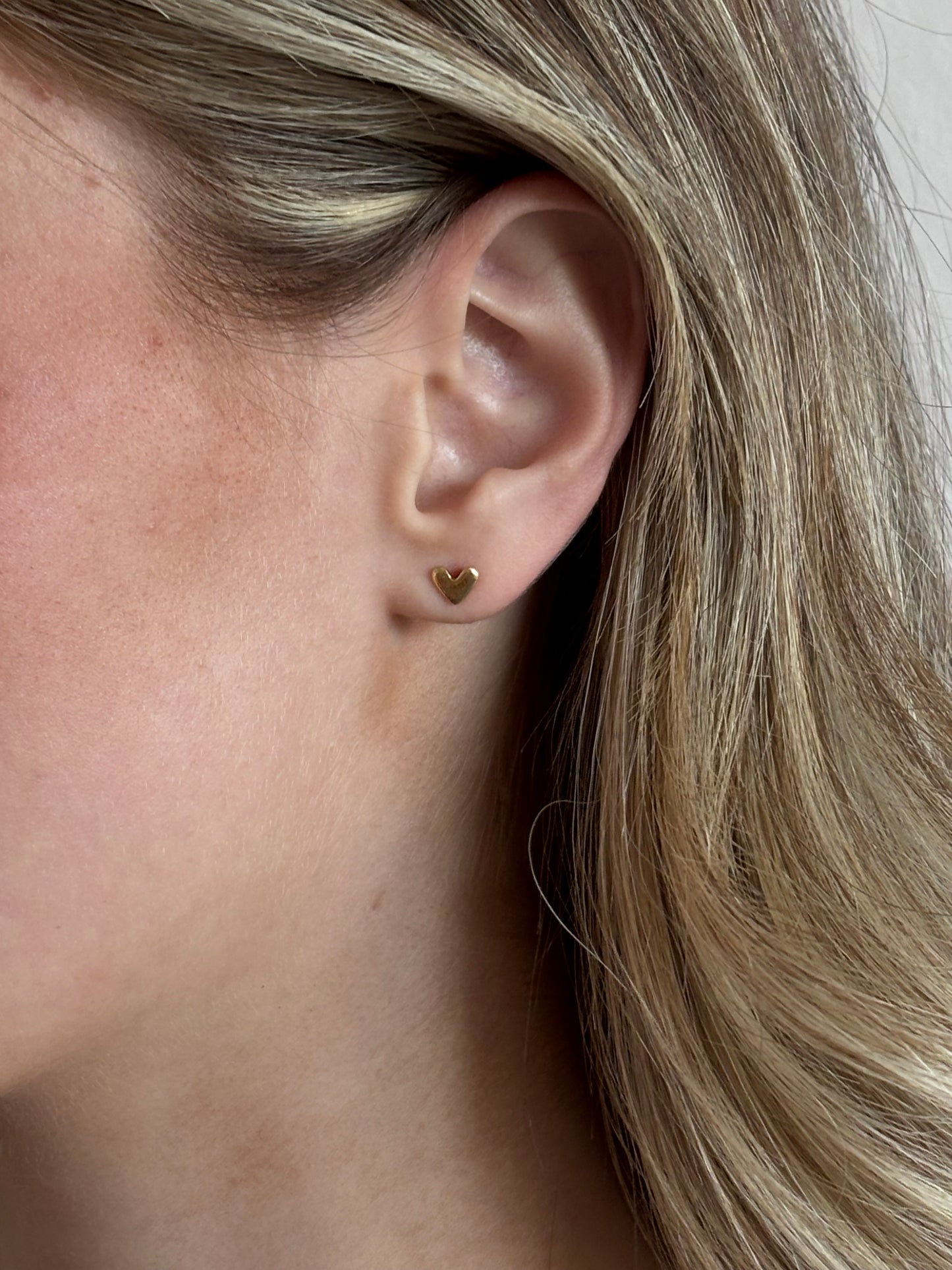 Tiny gold heart studs