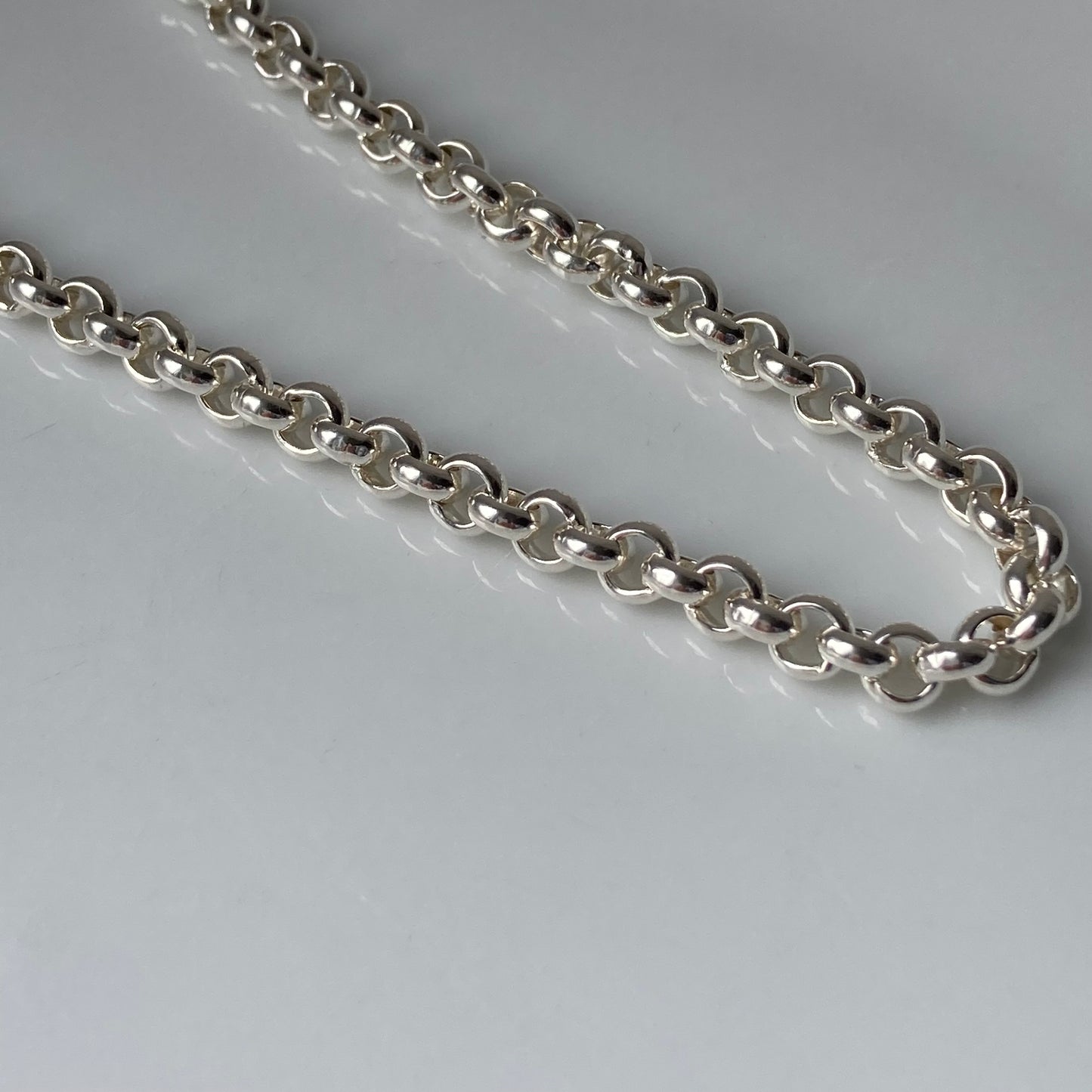 Chunky silver belcher chain.