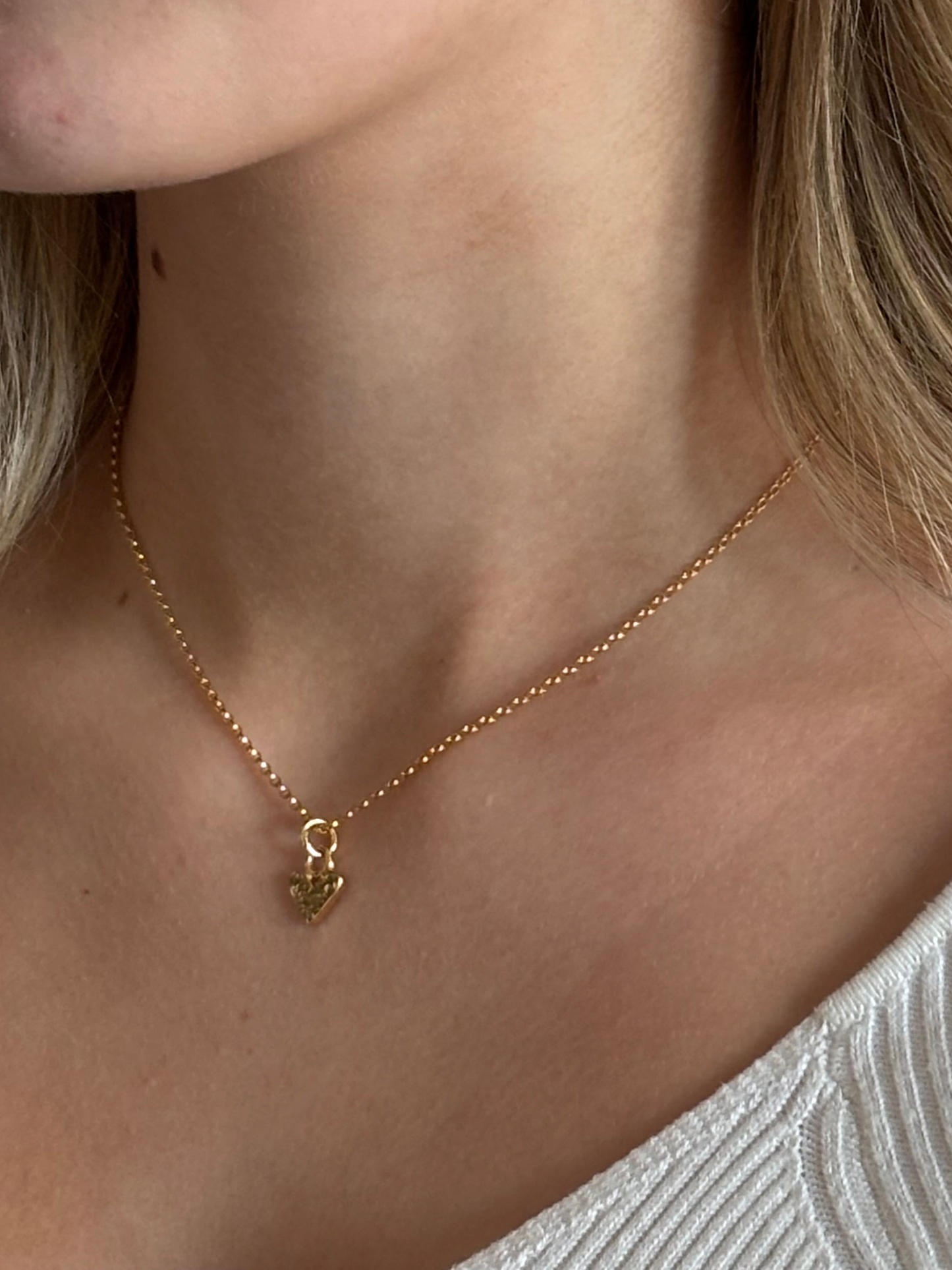 Gold mini heart charm necklace