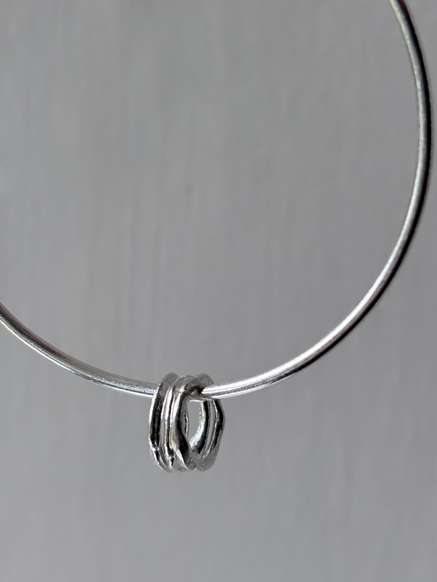 Silver Bangle with Molten Hoop Charms