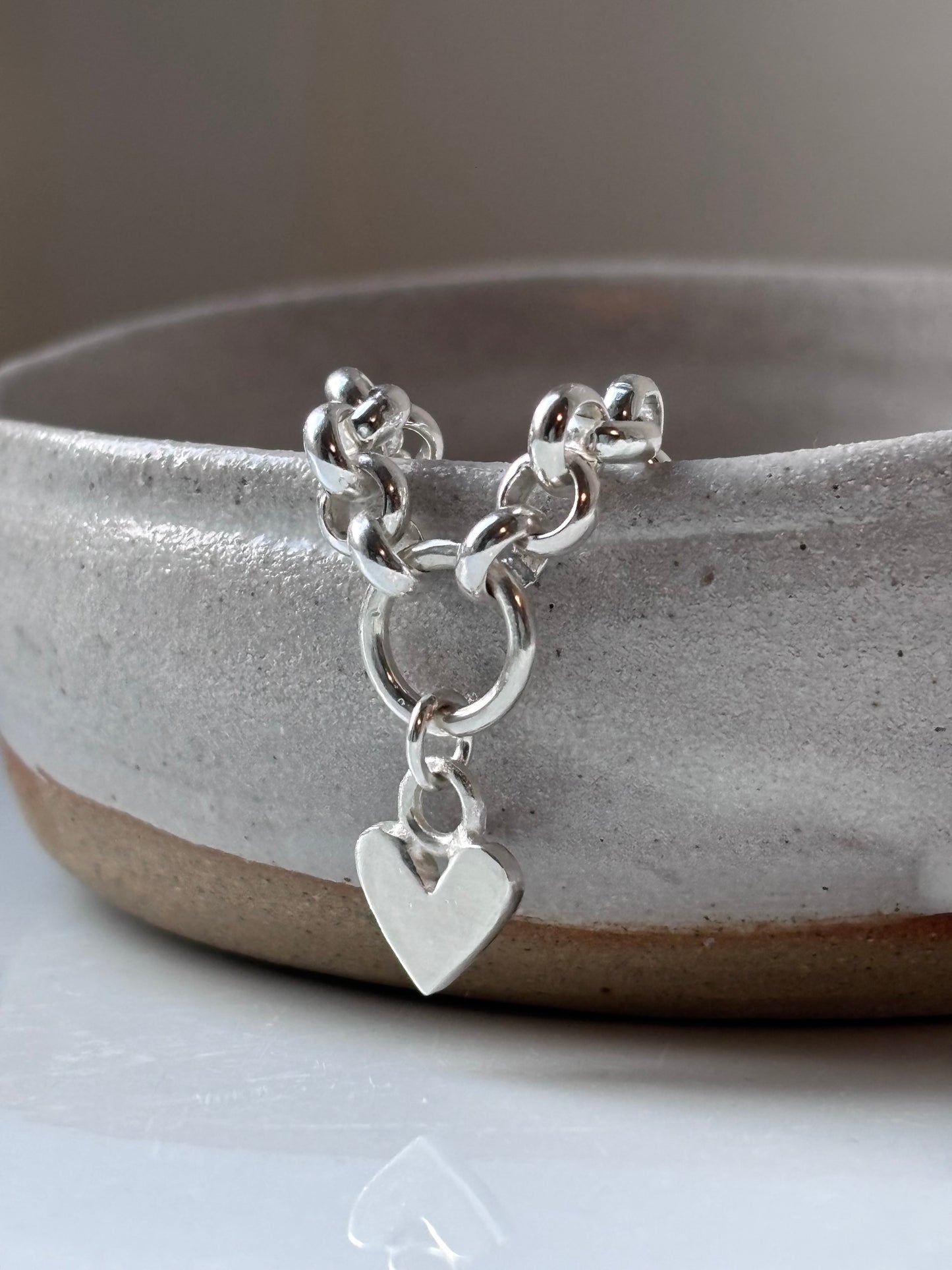 Heavy silver belcher charm necklace.