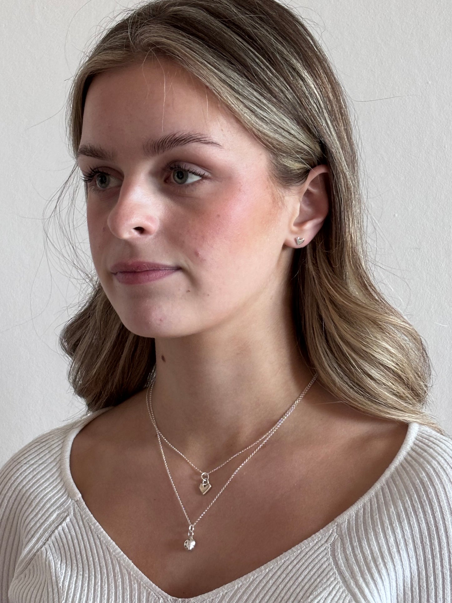 TINY SILVER HEART STUDS