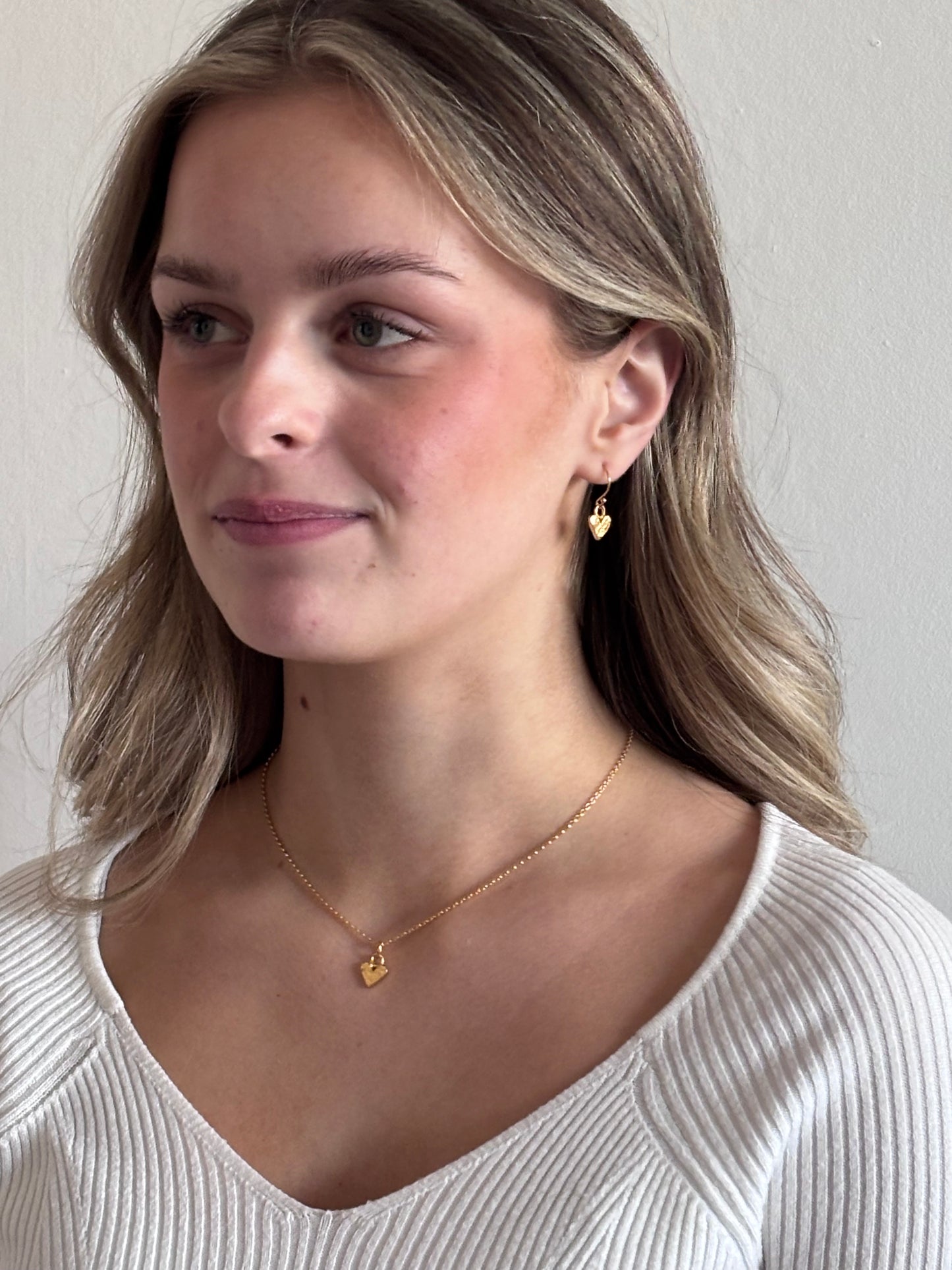 Gold mini heart charm necklace