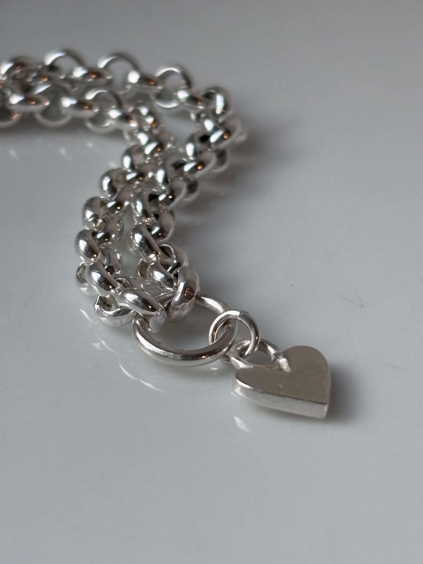 Heavy silver belcher charm necklace.