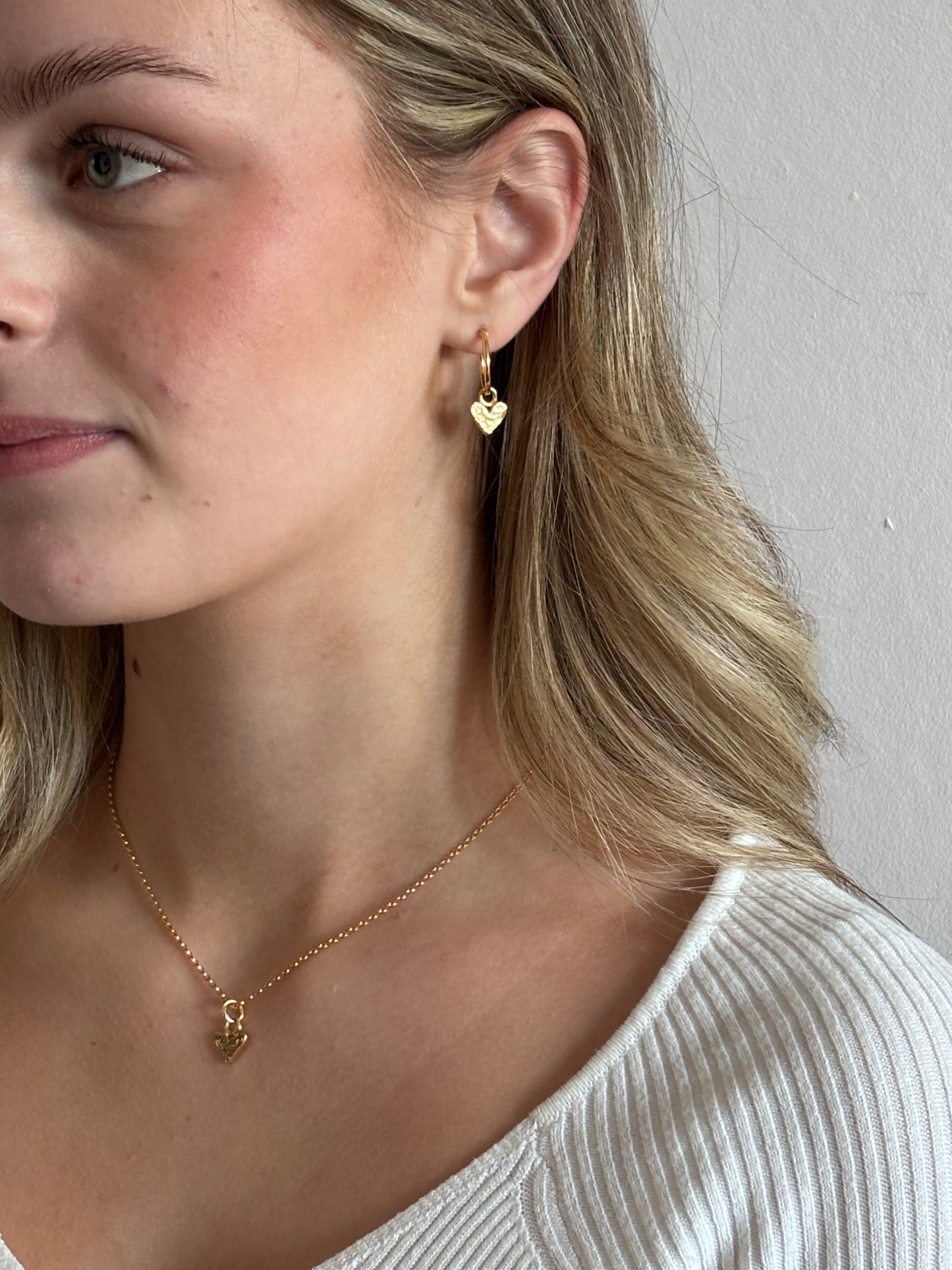 Gold mini heart charm necklace