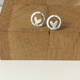 Small silver circle studs with hearts